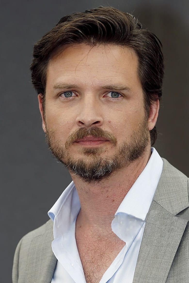 Portrait of Aden Young